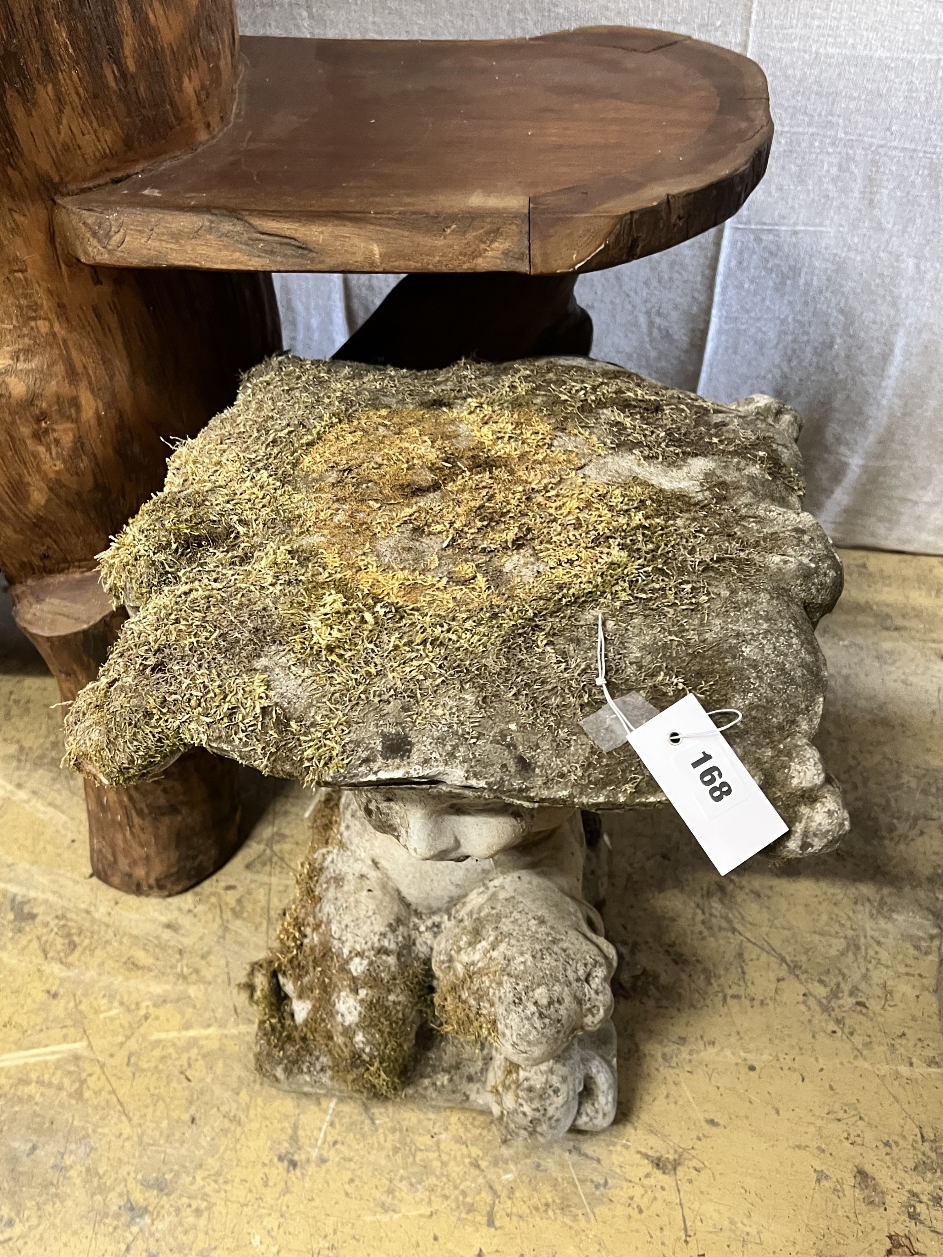 A reconstituted stone Faun garden seat, width 48cm height 46cm